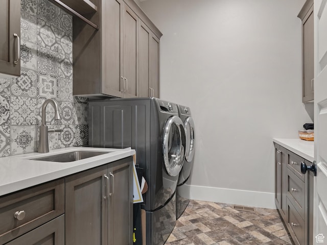 641 W 500 S, Midway, UT 84049 - clothes washing area featuring cabinet space, washer and dryer, brick floors, and baseboards