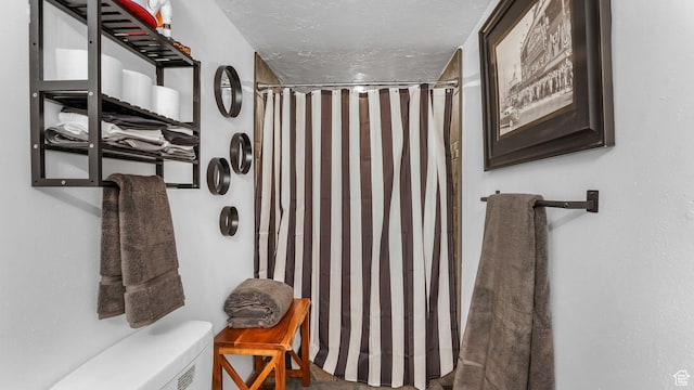 5394 W Shaggy Peak Dr, Riverton, UT 84096 - full bath with a shower with shower curtain, toilet, and a textured ceiling