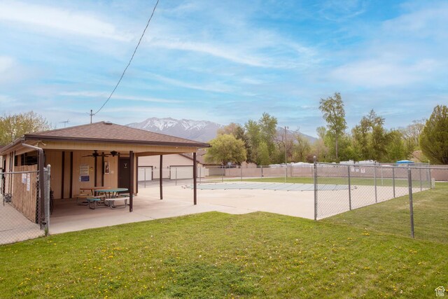 3937 S Lamplighter Way Unit 23, Riverdale, UT 84405 - view of property's community with a lawn, a mountain view, a patio, and fence