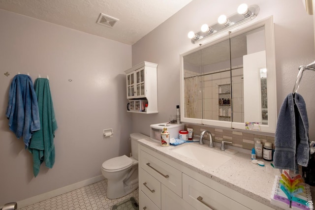 3937 S Lamplighter Way Unit 23, Riverdale, UT 84405 - full bathroom with visible vents, a shower with shower curtain, baseboards, toilet, and vanity