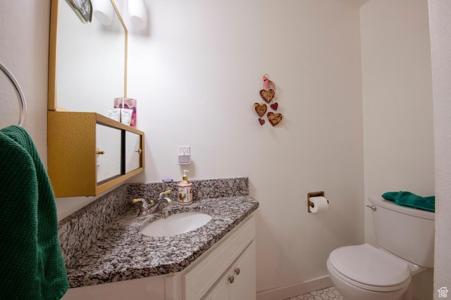 3937 S Lamplighter Way Unit 23, Riverdale, UT 84405 - half bathroom with toilet, tile patterned floors, vanity, and baseboards