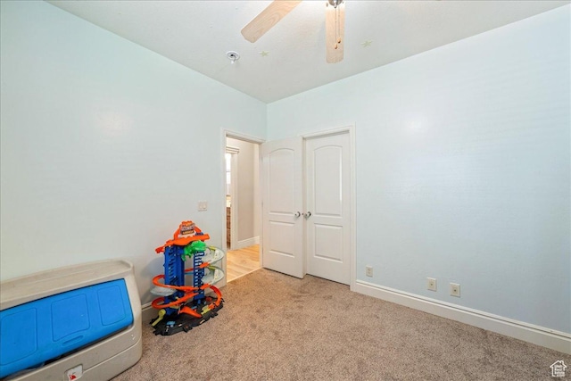 388 E 1060 S, Ivins, UT 84738 - unfurnished bedroom featuring a ceiling fan, light colored carpet, and baseboards