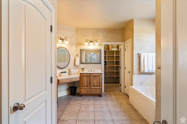 388 E 1060 S, Ivins, UT 84738 - bathroom with tile patterned floors, a garden tub, vanity, and a walk in closet