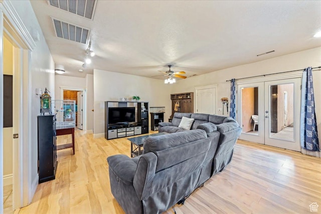 388 E 1060 S, Ivins, UT 84738 - living room with ceiling fan, visible vents, light wood-type flooring, and french doors