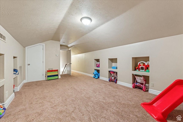 388 E 1060 S, Ivins, UT 84738 - game room featuring a textured ceiling, visible vents, carpet floors, vaulted ceiling, and built in features