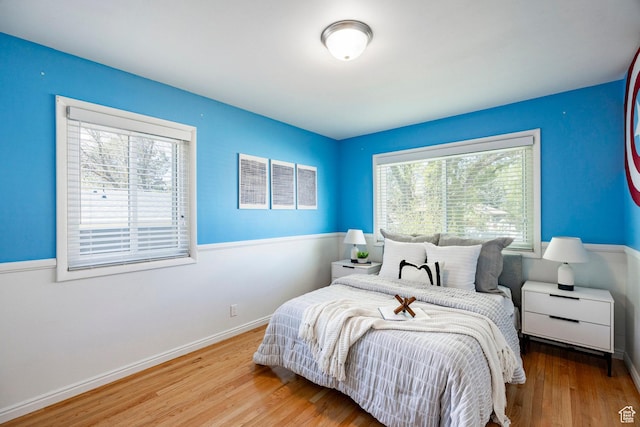 1151 E Chevy Chase Dr, Murray, UT 84117 - bedroom featuring wood finished floors and baseboards