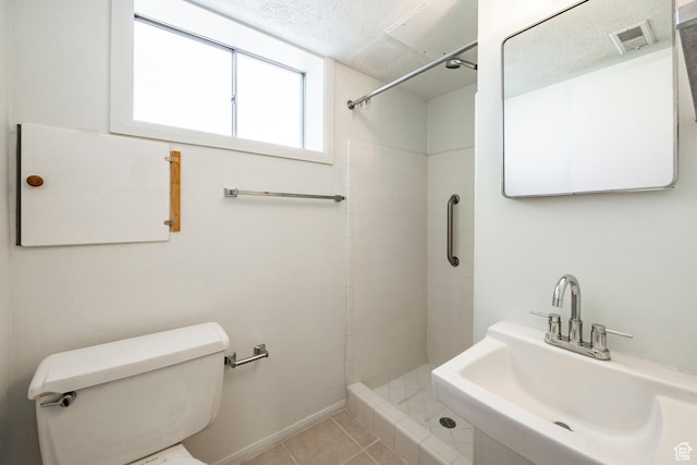 1151 E Chevy Chase Dr, Murray, UT 84117 - full bathroom with a tile shower, tile patterned floors, toilet, a sink, and baseboards