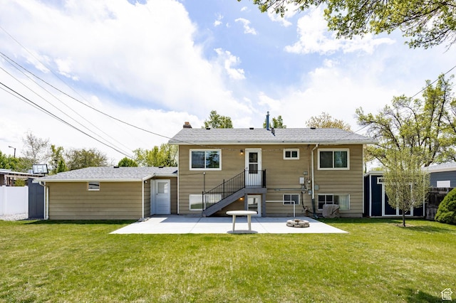 1151 E Chevy Chase Dr, Murray, UT 84117 - back of house with a chimney, a patio area, an outbuilding, an outdoor fire pit, and a yard
