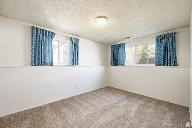 1151 E Chevy Chase Dr, Murray, UT 84117 - unfurnished room with a textured ceiling, visible vents, carpet flooring, and baseboards