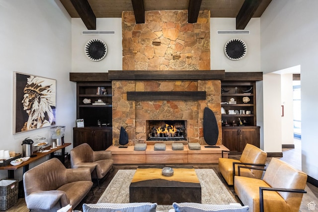 2177 E Notch Cir Unit 354, Heber City, UT 84032 - living area featuring wood finished floors, beamed ceiling, a towering ceiling, and a fireplace