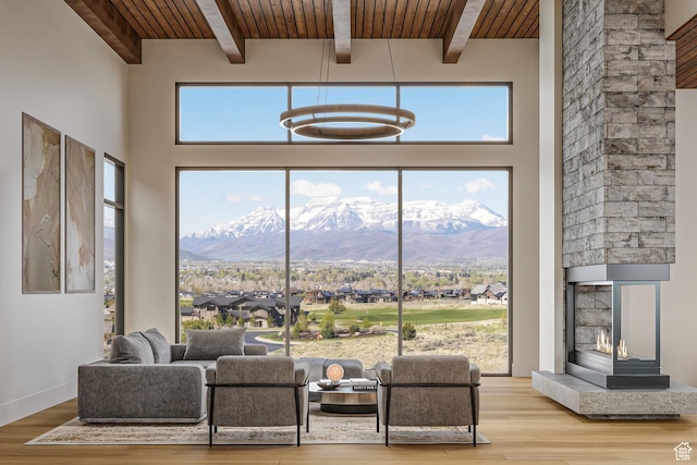 2177 E Notch Cir Unit 354, Heber City, UT 84032 - living room featuring a mountain view, wood finished floors, wood ceiling with exposed beams, a towering ceiling, and a chandelier