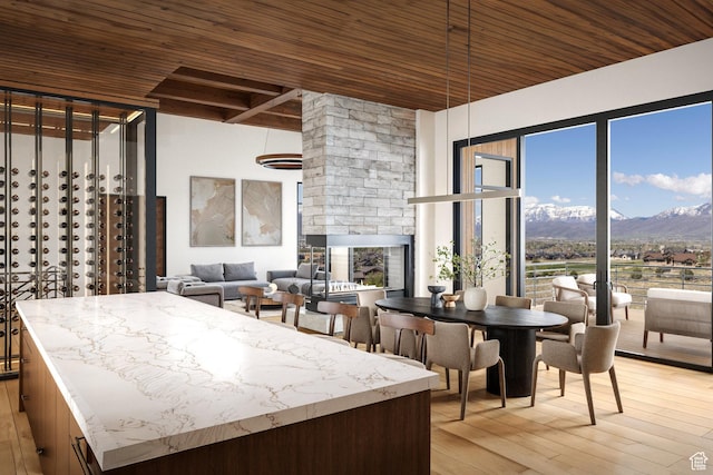 2177 E Notch Cir Unit 354, Heber City, UT 84032 - kitchen featuring wood ceiling with exposed beams, a mountain view, and light wood finished floors