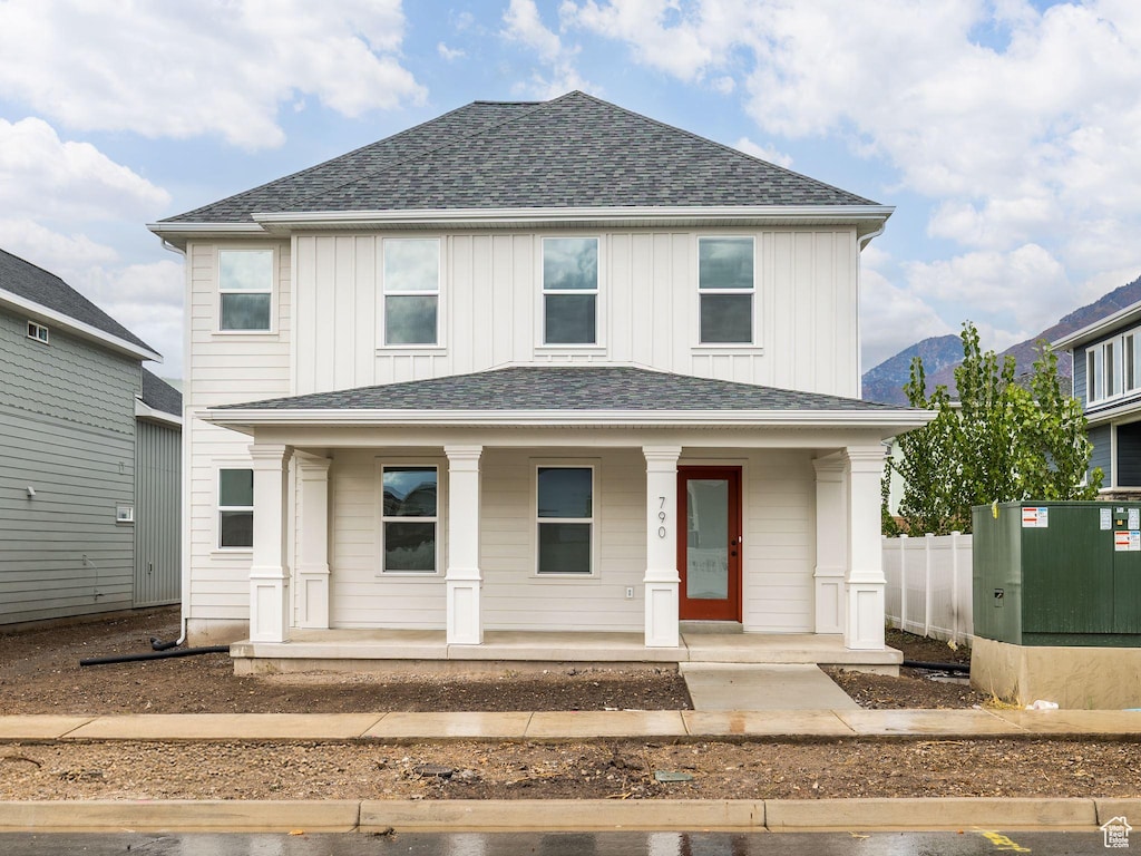 790 W 900 S, Springville, UT 84663 - view of front facade with a porch, a shingled roof, a mountain view, board and batten siding, and fence