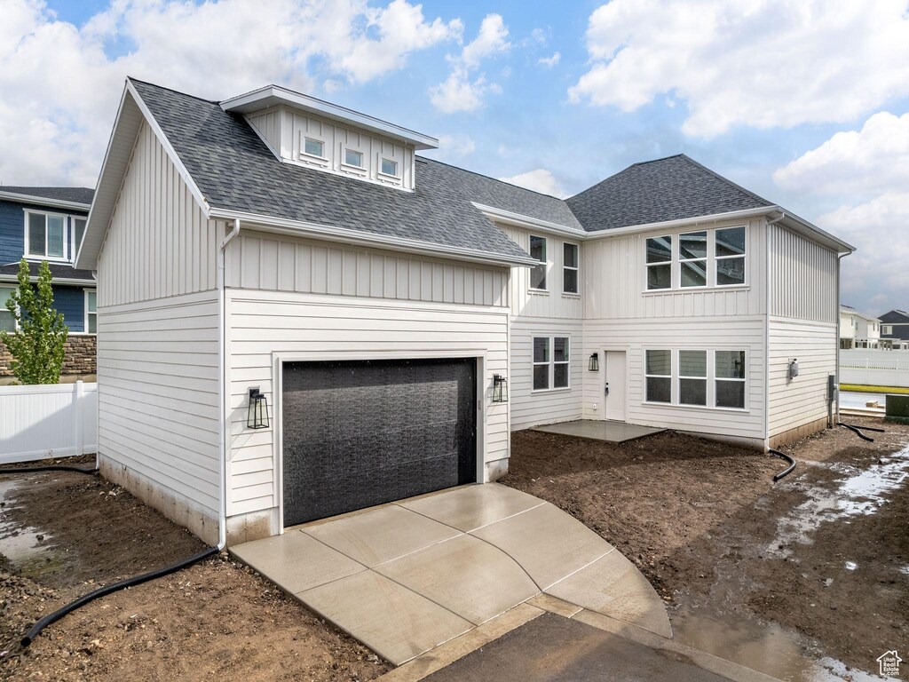 790 W 900 S, Springville, UT 84663 - view of front of house with an attached garage, fence, concrete driveway, and roof with shingles