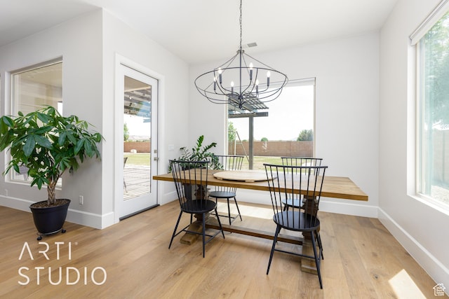 309 W Blue Quartz Dr, Washington, UT 84780 - dining room featuring plenty of natural light, baseboards, a chandelier, and light wood-style floors