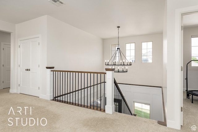 309 W Blue Quartz Dr, Washington, UT 84780 - corridor with an upstairs landing, carpet, visible vents, and a notable chandelier