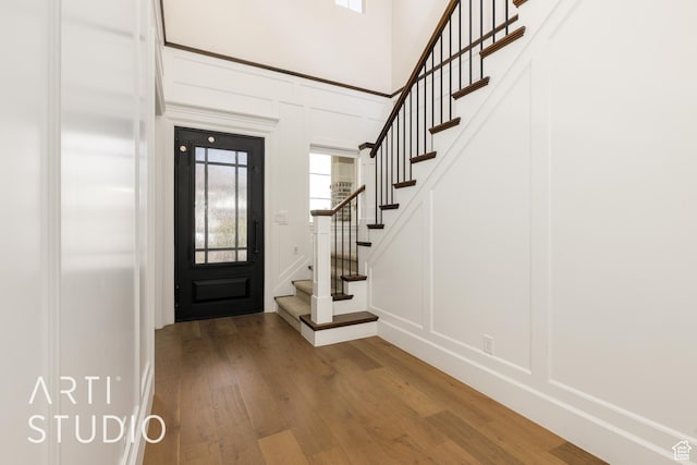 309 W Blue Quartz Dr, Washington, UT 84780 - entrance foyer with wood finished floors, stairs, and a decorative wall