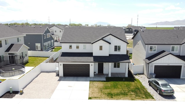 315 W 910 S, American Fork, UT 84003 - modern inspired farmhouse with a garage, a residential view, board and batten siding, concrete driveway, and fence