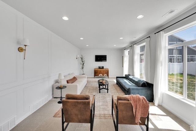 315 W 910 S, American Fork, UT 84003 - living room featuring light colored carpet, a decorative wall, and visible vents