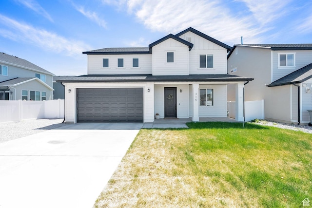 315 W 910 S, American Fork, UT 84003 - view of front of house with board and batten siding, covered porch, fence, a garage, and driveway