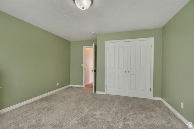 577 S 500 E, Santaquin, UT 84655 - unfurnished bedroom featuring baseboards, carpet floors, a textured ceiling, and a closet