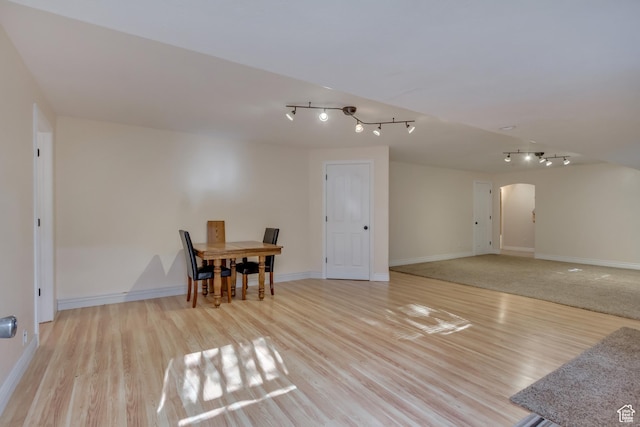 577 S 500 E, Santaquin, UT 84655 - dining space with arched walkways, track lighting, wood finished floors, and baseboards