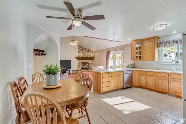 577 S 500 E, Santaquin, UT 84655 - kitchen with ceiling fan, light countertops, light brown cabinetry, dishwasher, and a stone fireplace