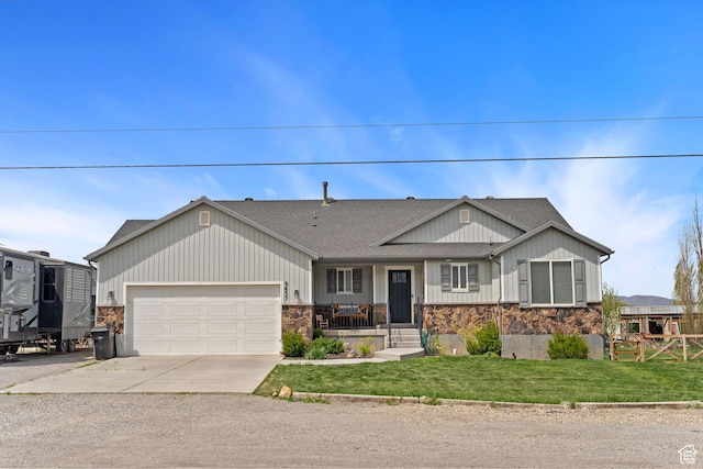 ranch-style home with a front yard, stone siding, roof with shingles, concrete driveway, and an attached garage