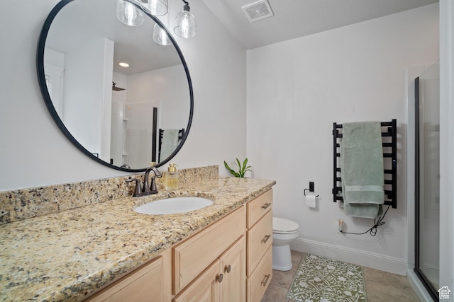 9457 N 4800 W, Elwood, UT 84337 - bathroom with a shower stall, visible vents, toilet, tile patterned floors, and vanity