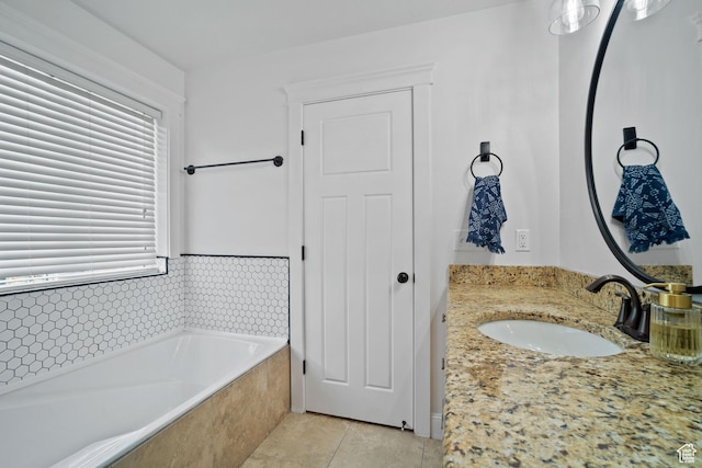9457 N 4800 W, Elwood, UT 84337 - bathroom featuring a garden tub, tile patterned flooring, and vanity