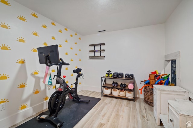 9457 N 4800 W, Elwood, UT 84337 - workout area featuring baseboards and light wood-type flooring