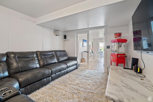 9457 N 4800 W, Elwood, UT 84337 - living area featuring wood finished floors and a decorative wall