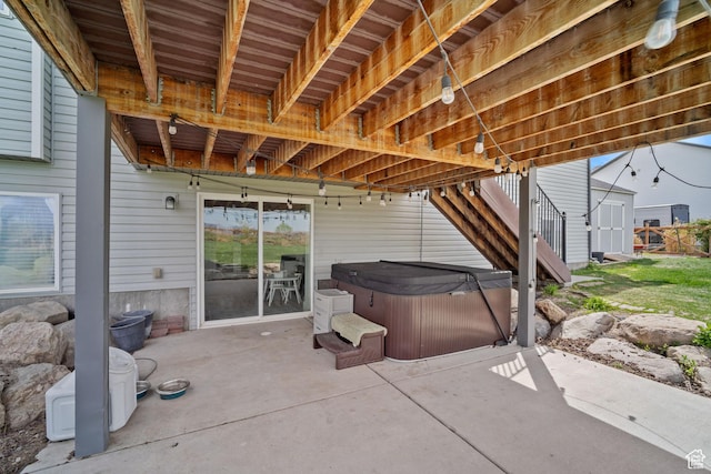 9457 N 4800 W, Elwood, UT 84337 - view of patio / terrace with an outdoor structure, a hot tub, and a storage shed