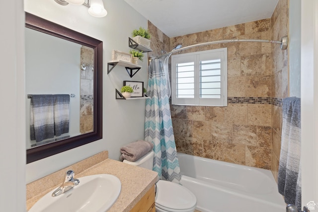 bathroom featuring shower / tub combo with curtain, toilet, and vanity
