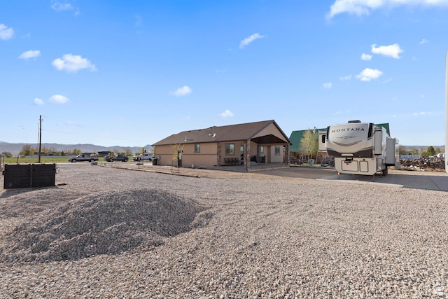 back of house featuring a mountain view