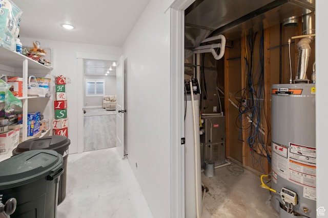 utility room featuring water heater