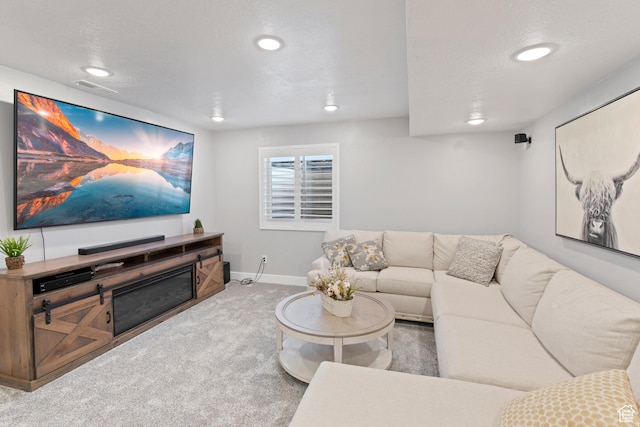 carpeted living area with visible vents, recessed lighting, and baseboards