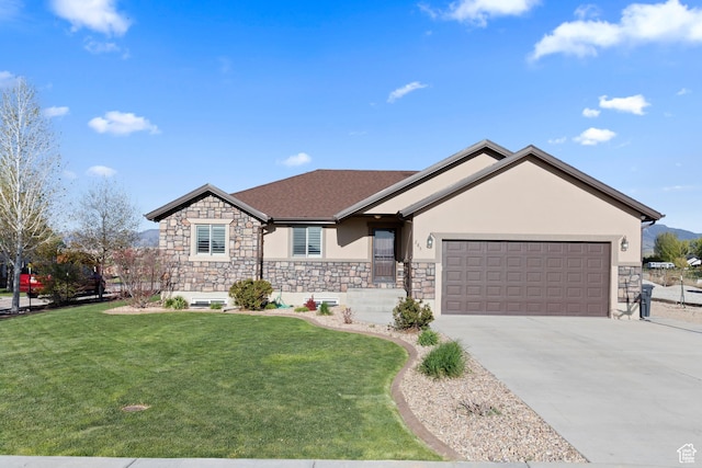 single story home with a front lawn, stucco siding, stone siding, concrete driveway, and an attached garage