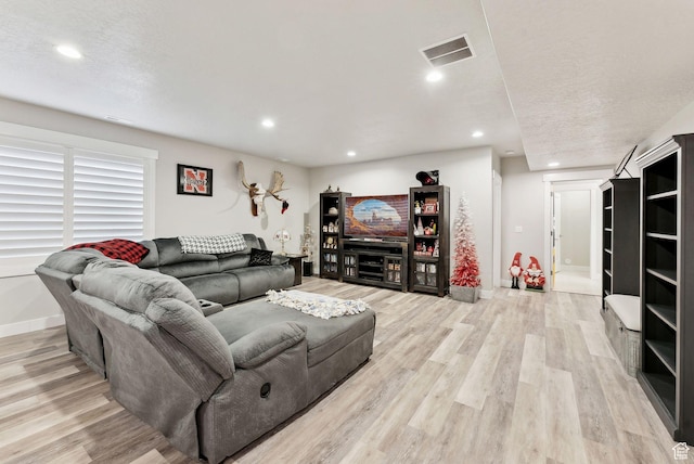 6593 W Bonnie Jean Ln Unit 13, Herriman, UT 84096 - living area featuring baseboards, visible vents, light wood-style flooring, and recessed lighting