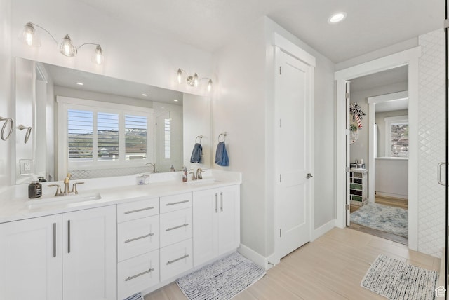 6593 W Bonnie Jean Ln Unit 13, Herriman, UT 84096 - full bath featuring a wealth of natural light, wood finished floors, and a sink