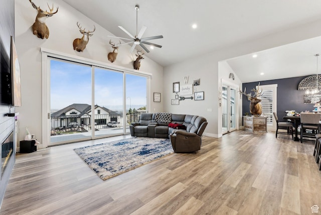 6593 W Bonnie Jean Ln Unit 13, Herriman, UT 84096 - living room featuring recessed lighting, ceiling fan with notable chandelier, light wood-style floors, and high vaulted ceiling