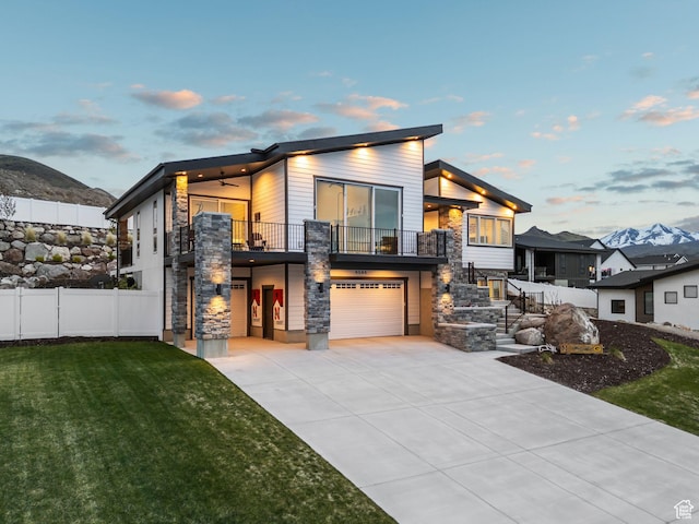 6593 W Bonnie Jean Ln Unit 13, Herriman, UT 84096 - contemporary house with driveway, a balcony, a front yard, fence, and a garage