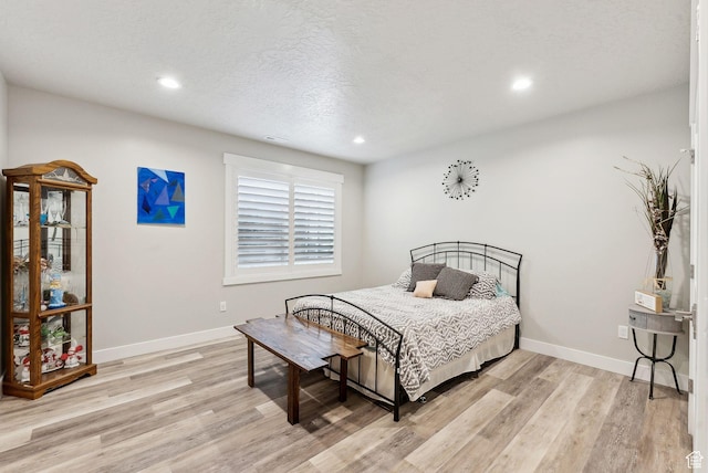 6593 W Bonnie Jean Ln Unit 13, Herriman, UT 84096 - bedroom with baseboards, recessed lighting, a textured ceiling, and light wood finished floors