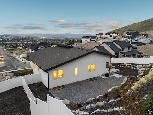 6593 W Bonnie Jean Ln Unit 13, Herriman, UT 84096 - aerial view at dusk featuring a mountain view and a residential view
