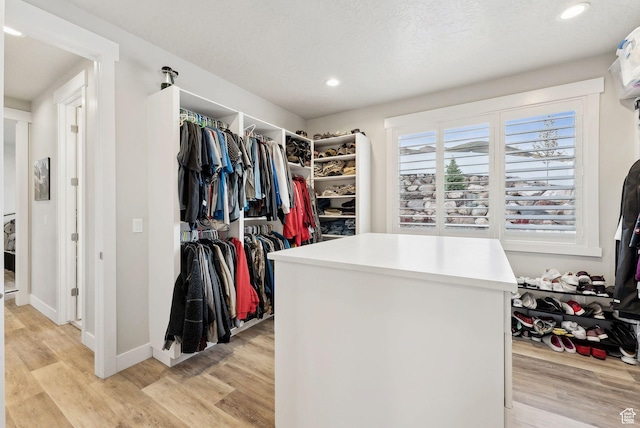 6593 W Bonnie Jean Ln Unit 13, Herriman, UT 84096 - walk in closet featuring light wood-type flooring