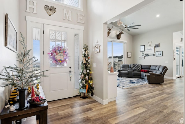 6593 W Bonnie Jean Ln Unit 13, Herriman, UT 84096 - foyer featuring light wood-type flooring, a high ceiling, and baseboards