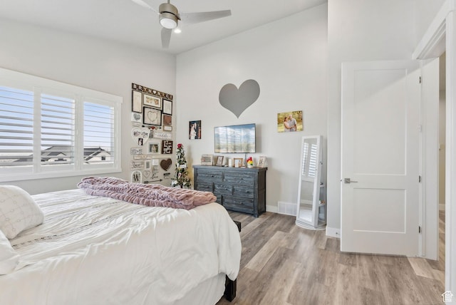 6593 W Bonnie Jean Ln Unit 13, Herriman, UT 84096 - bedroom featuring ceiling fan, light wood-type flooring, high vaulted ceiling, and baseboards