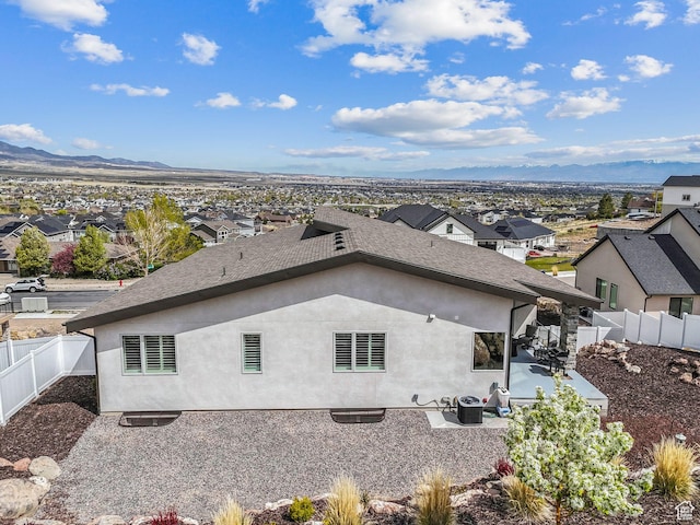 6593 W Bonnie Jean Ln Unit 13, Herriman, UT 84096 - exterior space with central AC, a mountain view, a patio, and a fenced backyard