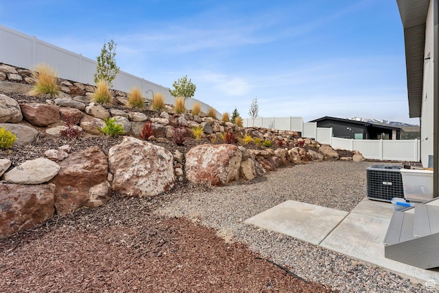 6593 W Bonnie Jean Ln Unit 13, Herriman, UT 84096 - view of yard featuring fence and central AC unit