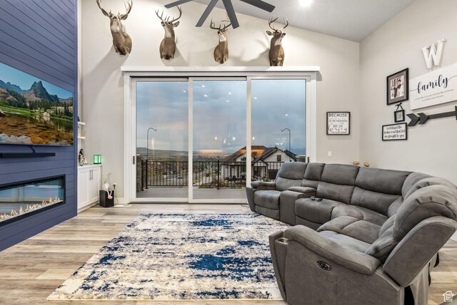 6593 W Bonnie Jean Ln Unit 13, Herriman, UT 84096 - living area with a ceiling fan, a large fireplace, and wood finished floors